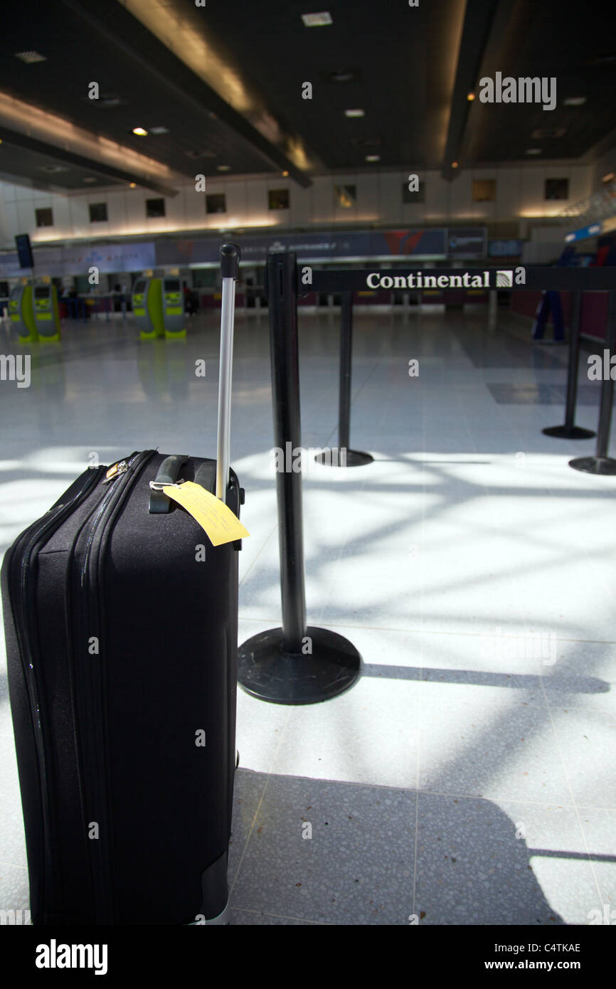 Terminal 2, Manchester Airport, England, holiday suitcase near