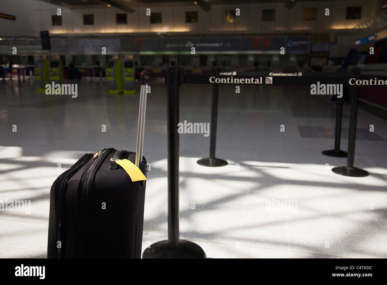 Terminal 2, Manchester Airport, England, holiday suitcase near