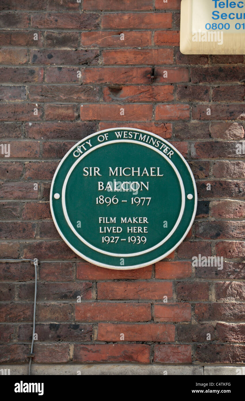 A City of Westminster green plaque to Sir Michael Balcon in Tufton Street, Westminster, London, UK. Stock Photo