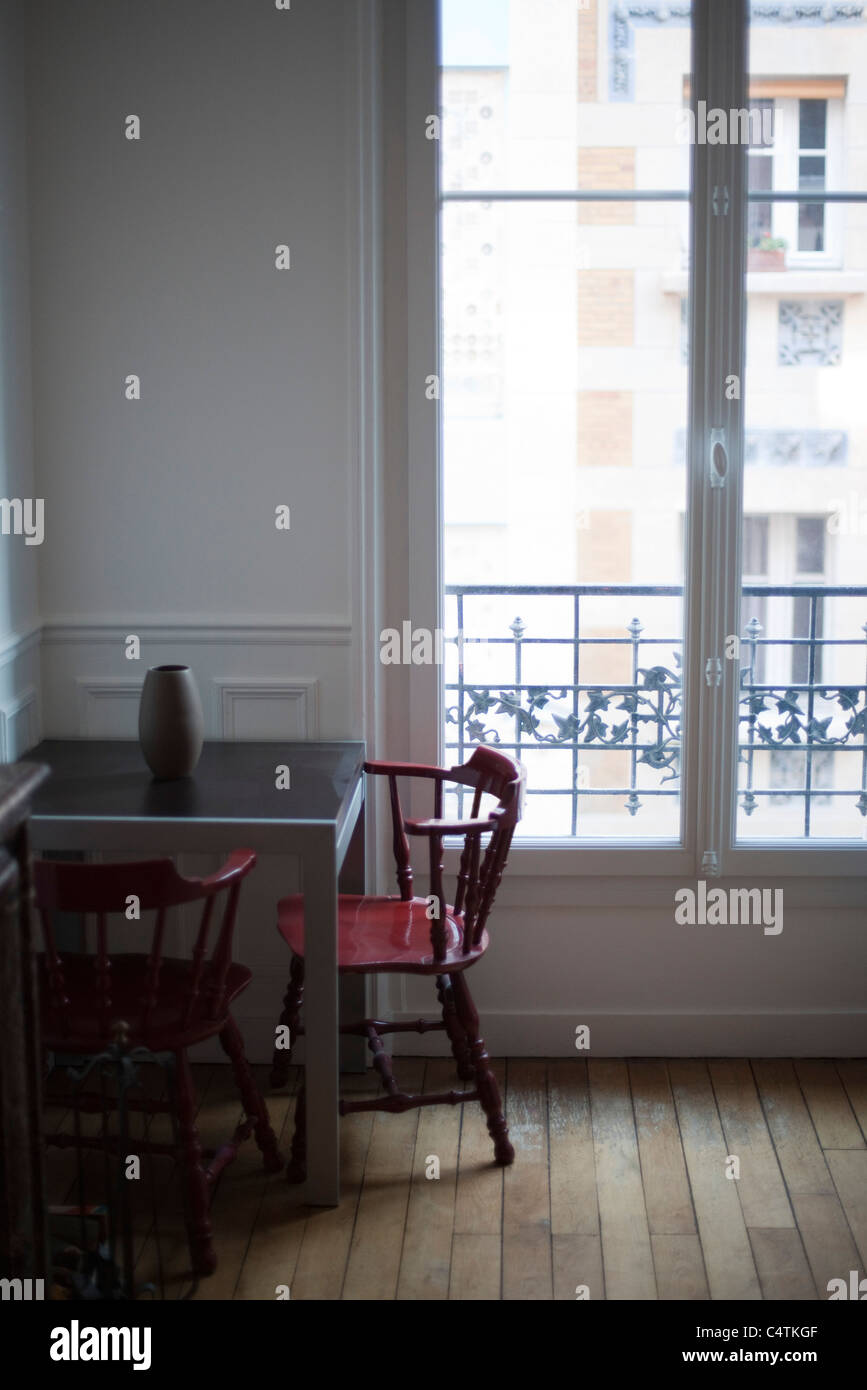 Table and chairs by window Stock Photo Alamy