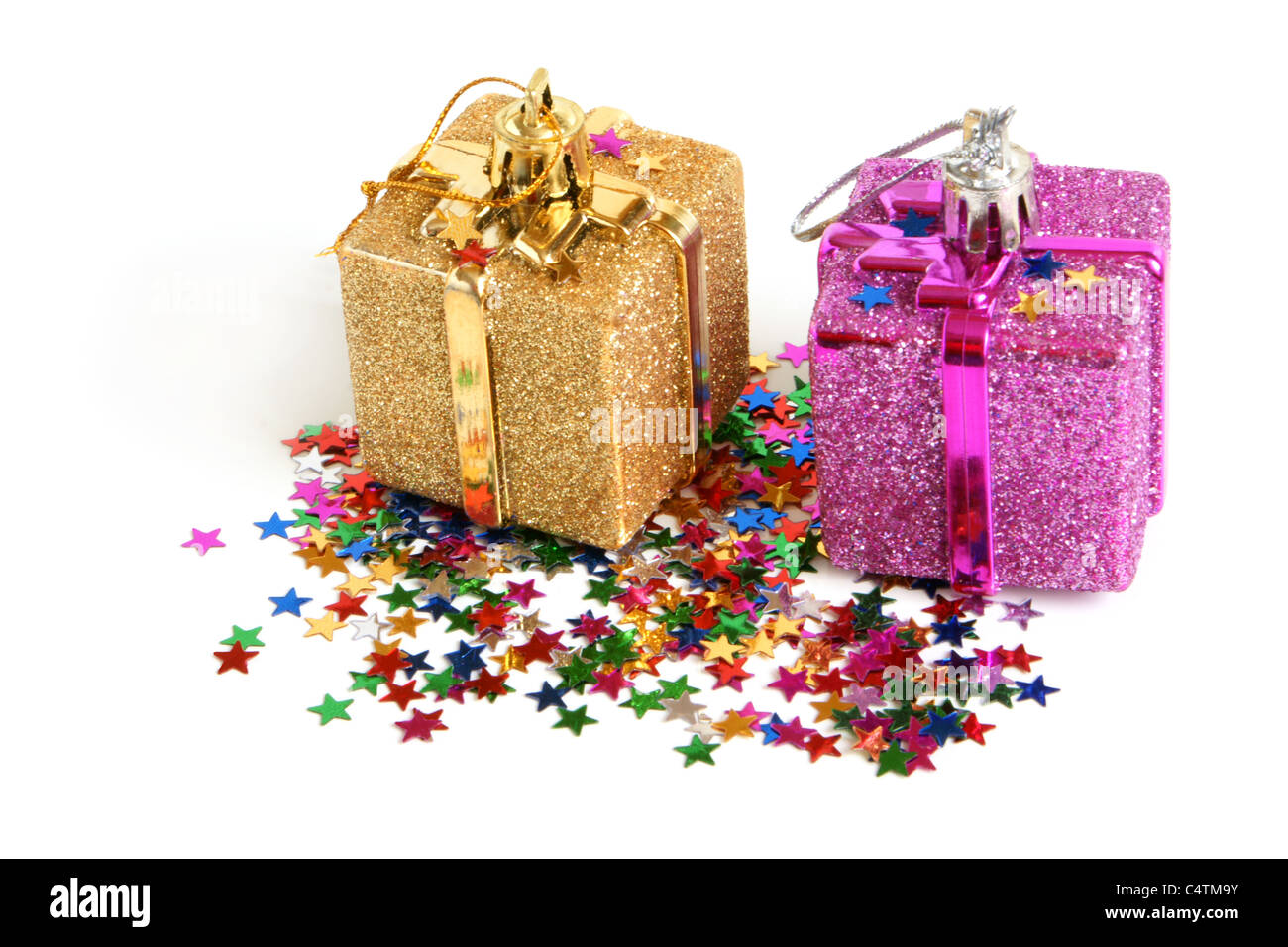 Two christmas toys with confetti Stock Photo Alamy