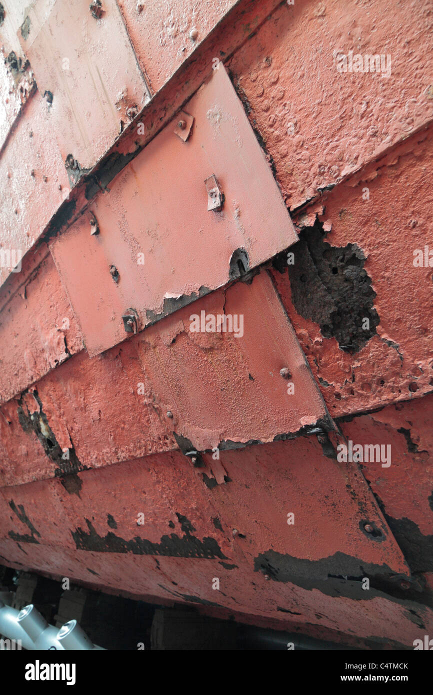 View of repaired 1937 scuttling holes along the starboard side of Brunel's SS Great Britain in dry dock, Bristol Docks, UK. Stock Photo