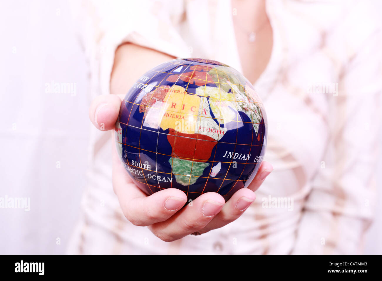 Beautiful Hand holding the world Stock Photo - Alamy