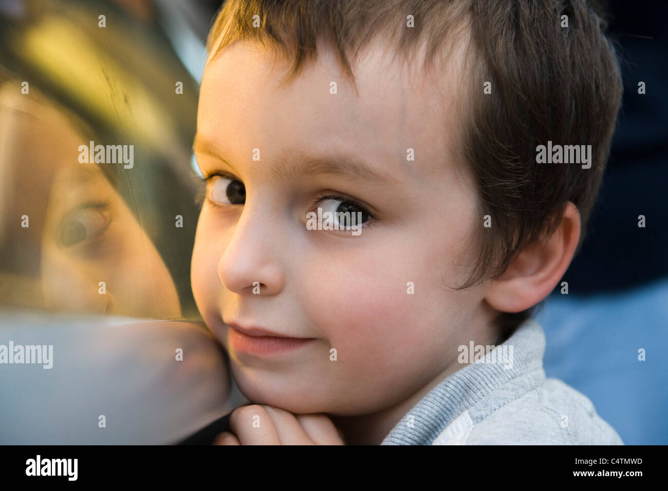Boy glancing sideways at camera, portrait Stock Photo