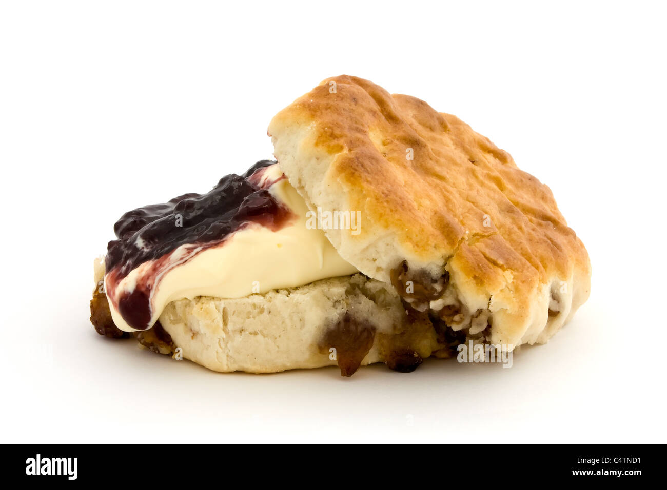 Fresh fruit scone with clotted cream and jam isolated on white Stock Photo
