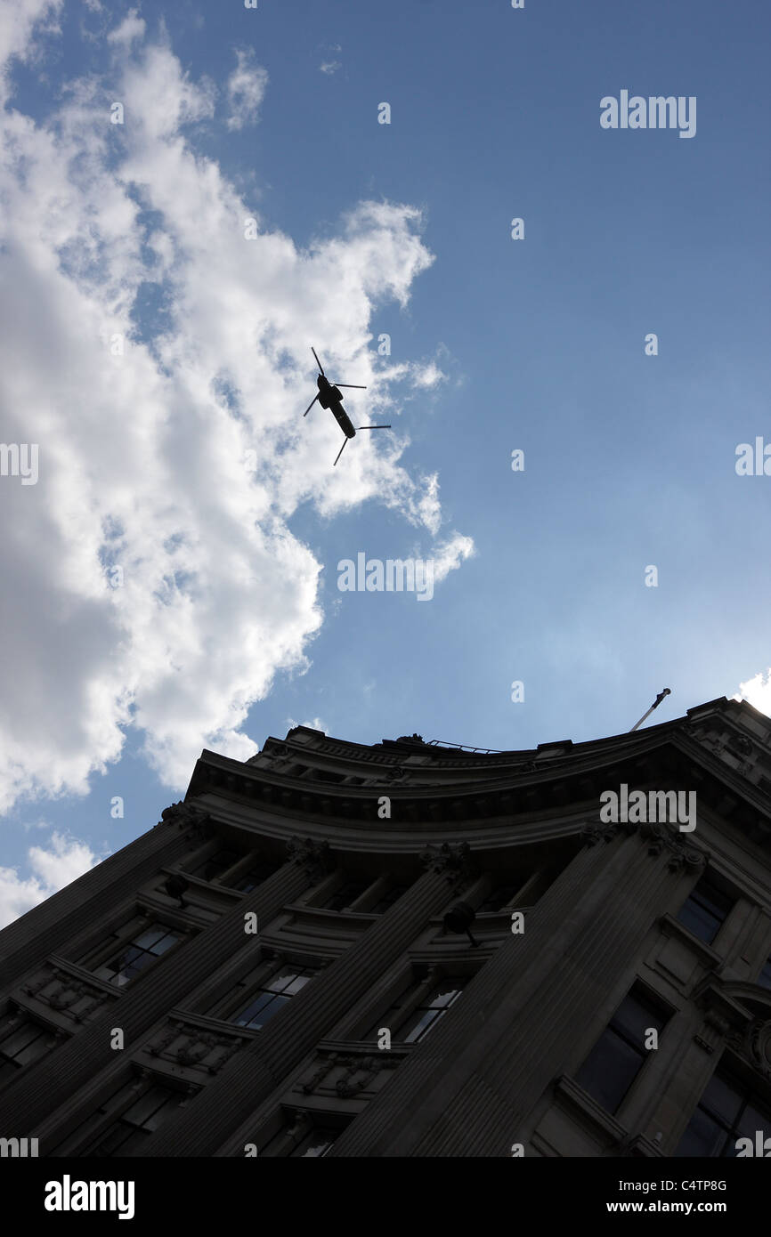 CHINOOK HELICOPTER, grab shot of said helicopter flying low over Oxford Circus in the heart of London`s West End. Stock Photo