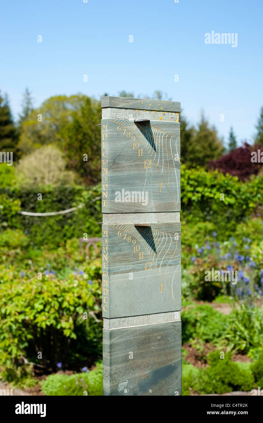 Sundial in The Shrub Rose Garden in April, RHS Rosemoor, Devon, England, United Kingdom Stock Photo