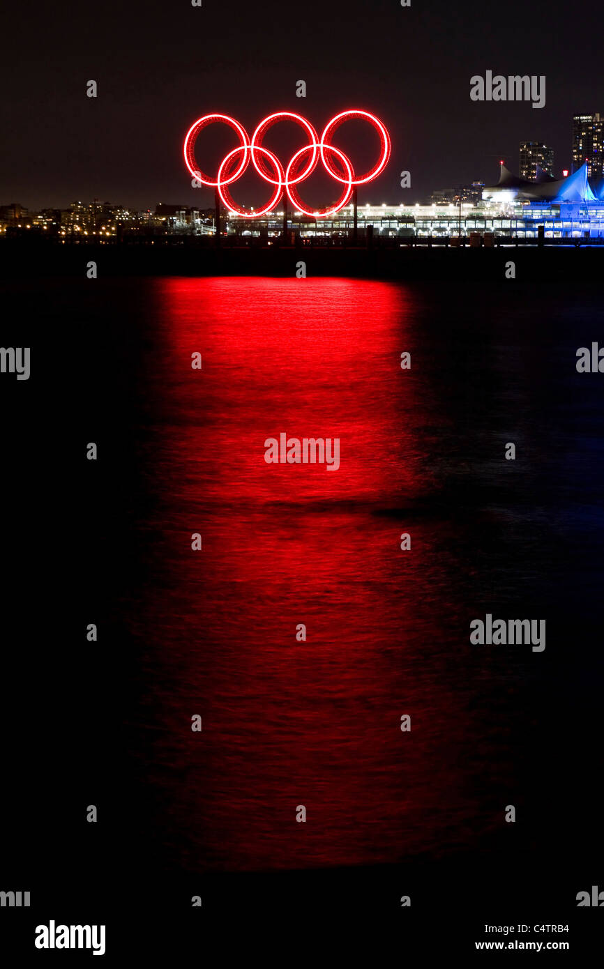 Red glowing Olympic rings refelcted in the harbour during the 2010 Winter Olympic Games, Vancouver, Canada Stock Photo