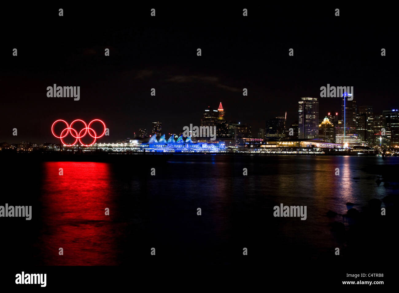 Red glowing Olympic rings, Canada Place and media center during the 2010 Winter Olympic Games, Vancouver, Canada Stock Photo