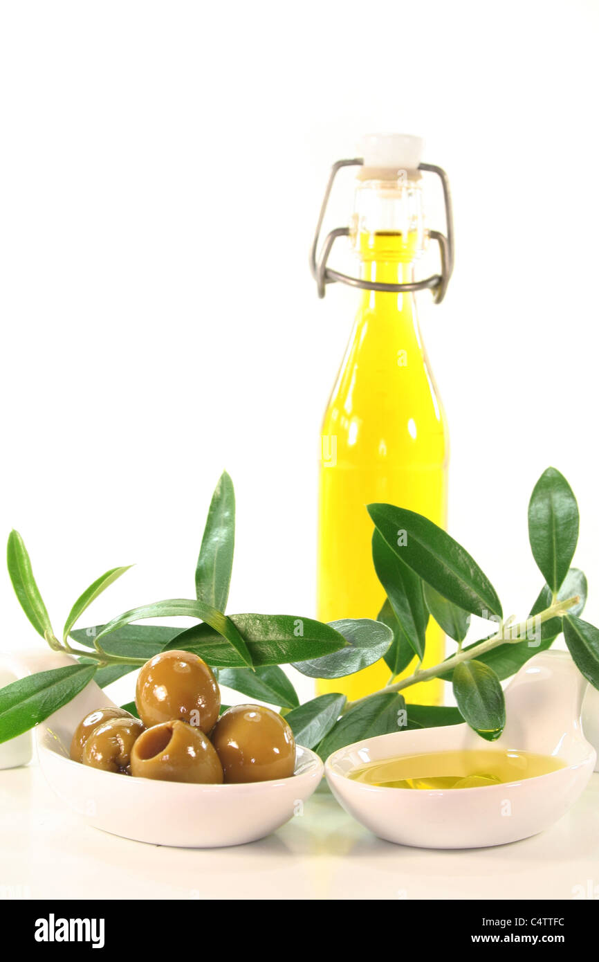 Olive oil with olives and olive branch served in bite spoons Stock ...