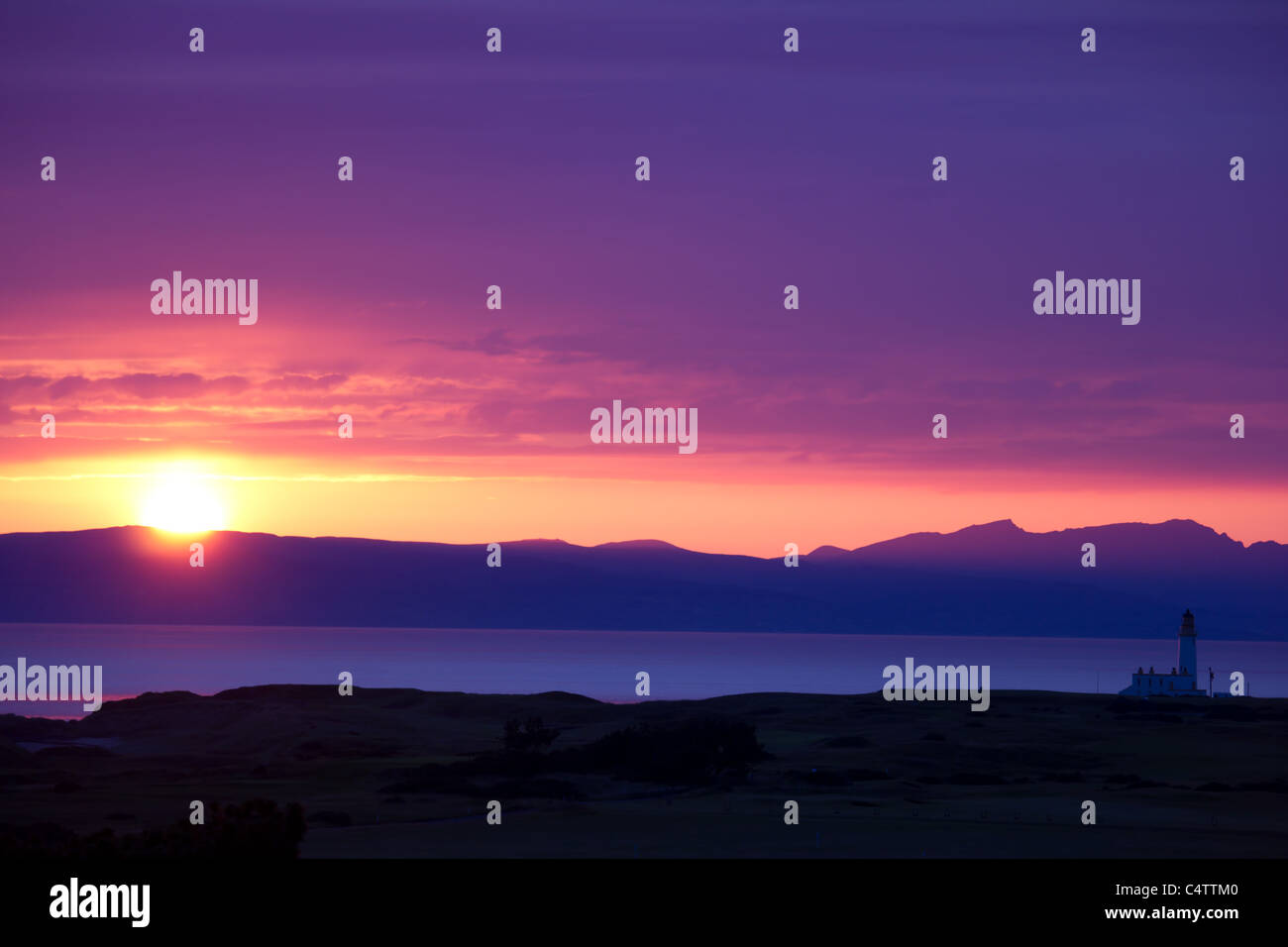 sunset over mountains and ocean Stock Photo