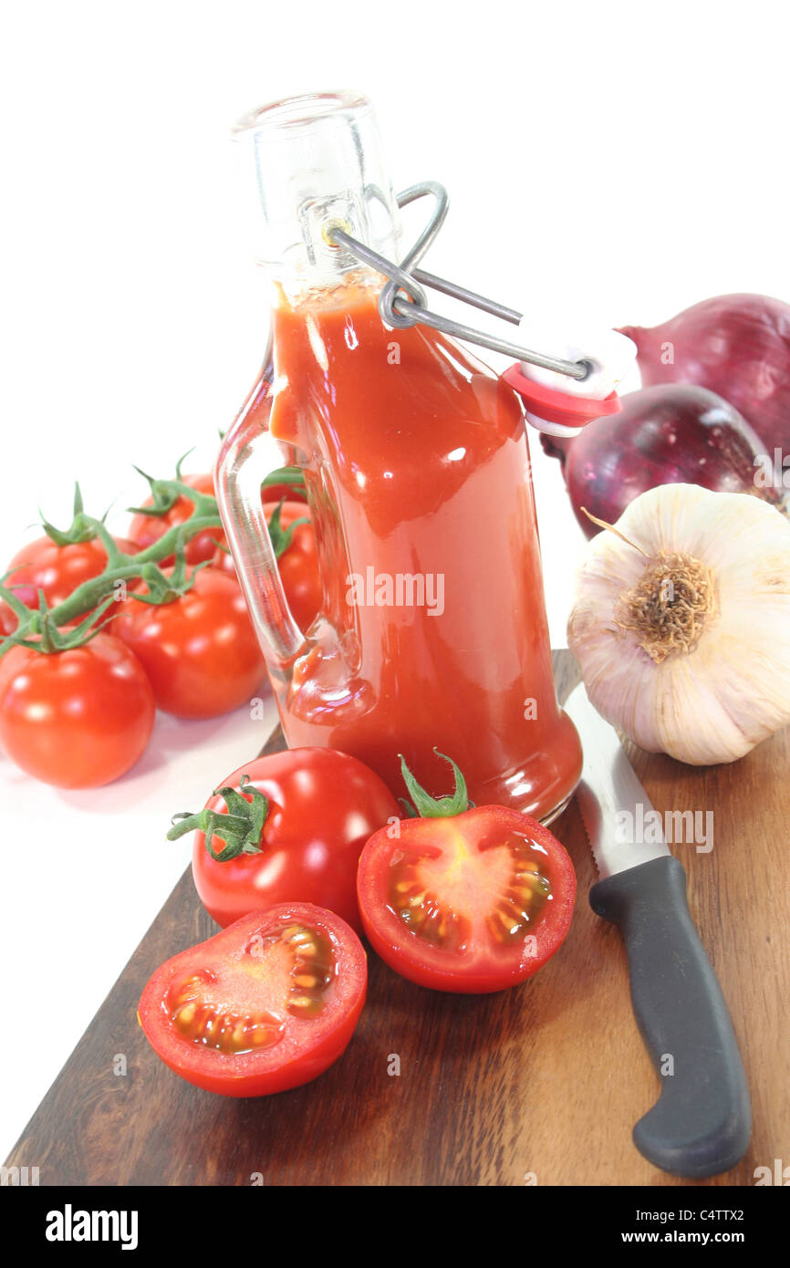 Tomato ketchup with tomatoes, garlic, onions and basil Stock Photo Alamy