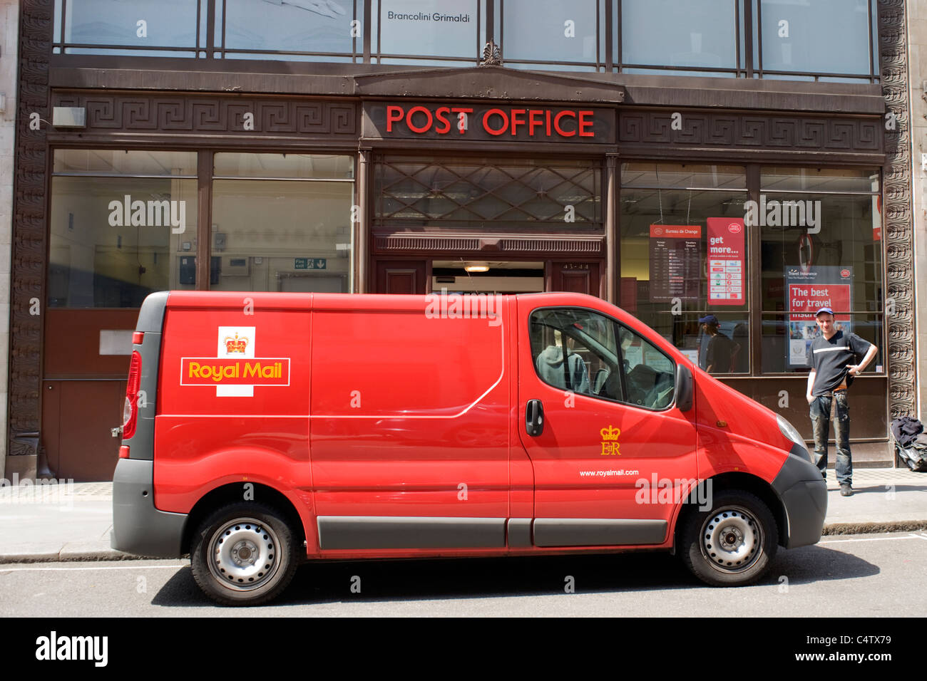London Mayfair Albemarle Street Post Office with red Royal Mail van parked outside Stock Photo