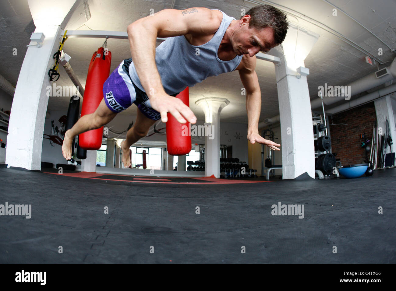 male doing jump push ups Stock Photo - Alamy