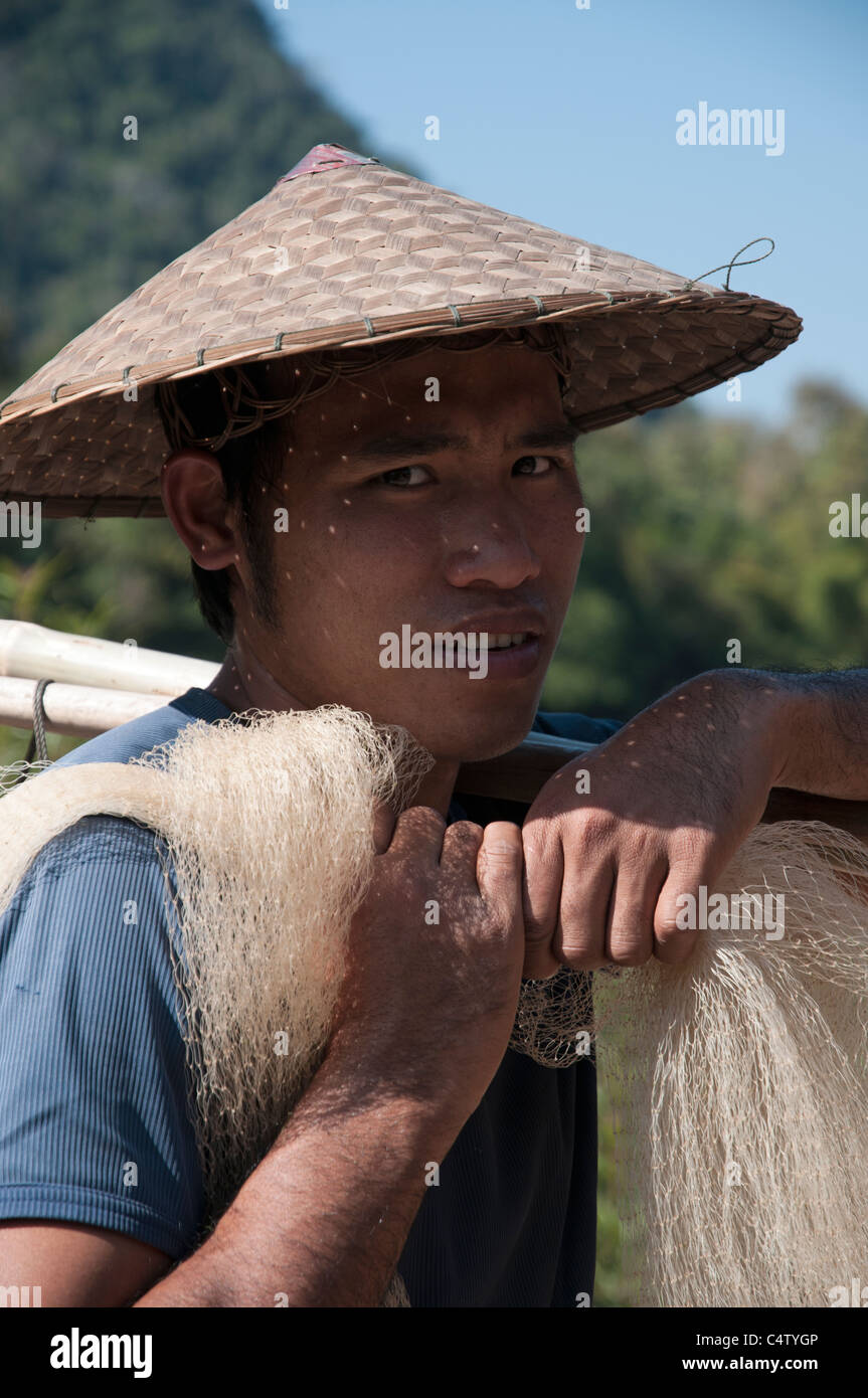 A fisherman coming back to his village after a working day, in Laos Stock Photo