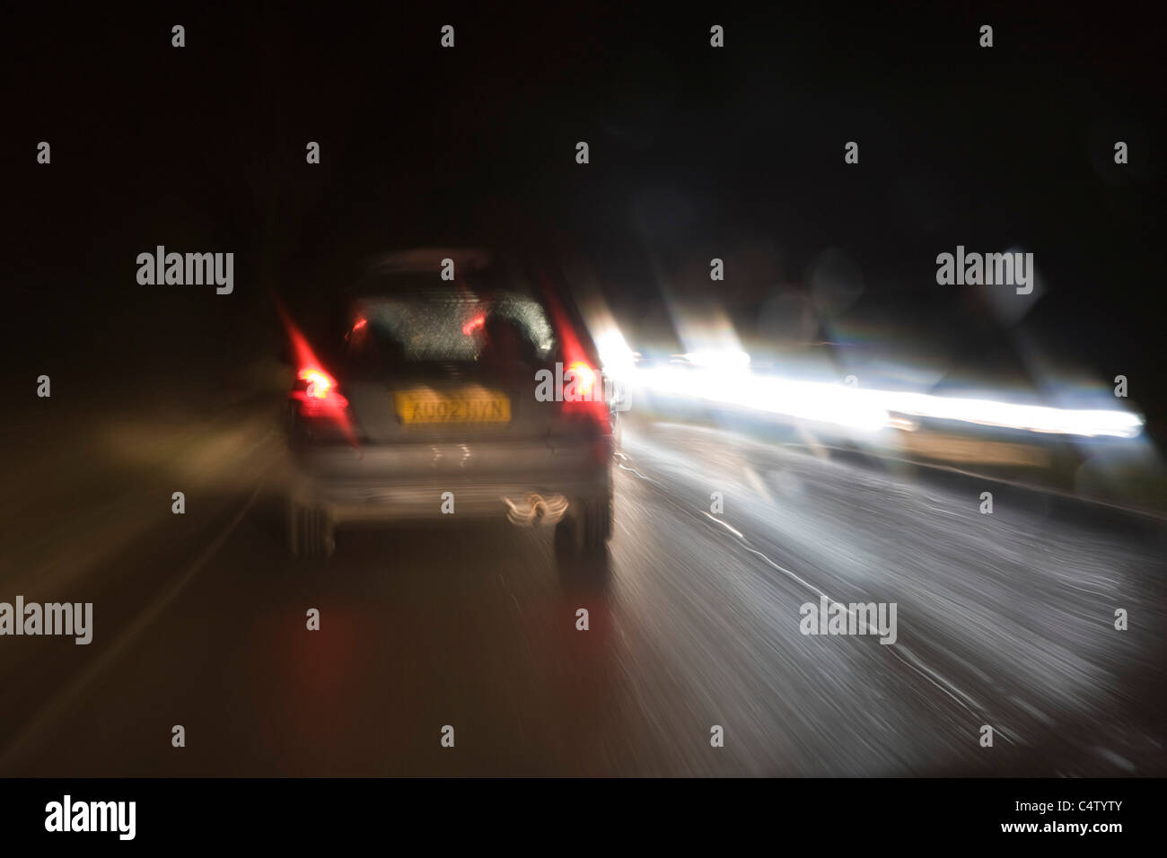 Driving car at rainy night. Stock Photo