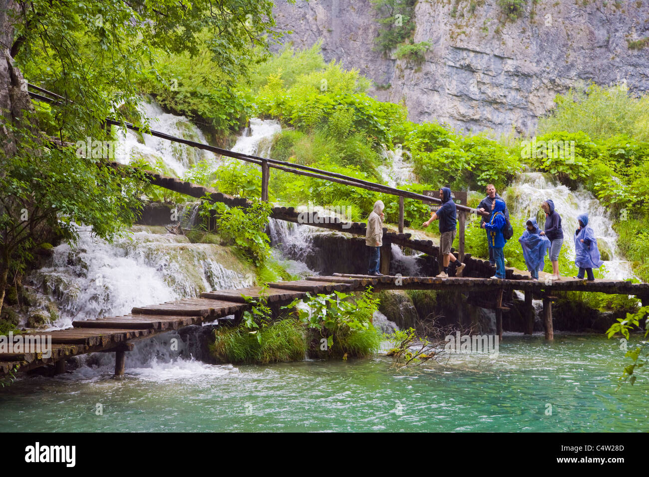 Tourists on the path at Plitvicka Jezera, Plitvice Lakes National Park, Lika-Senj, Croatia Stock Photo