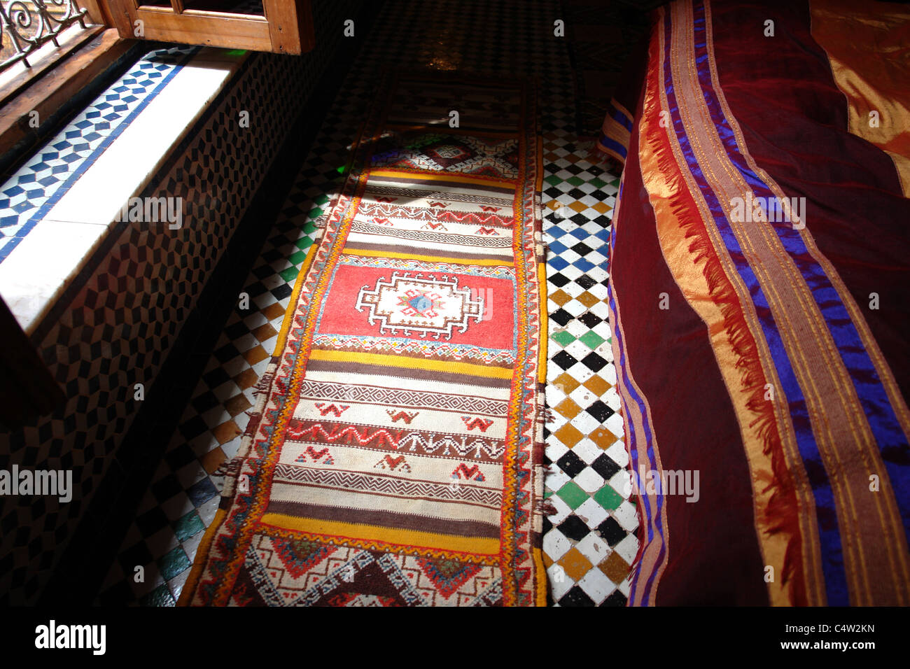 rug on tile floor Stock Photo Alamy