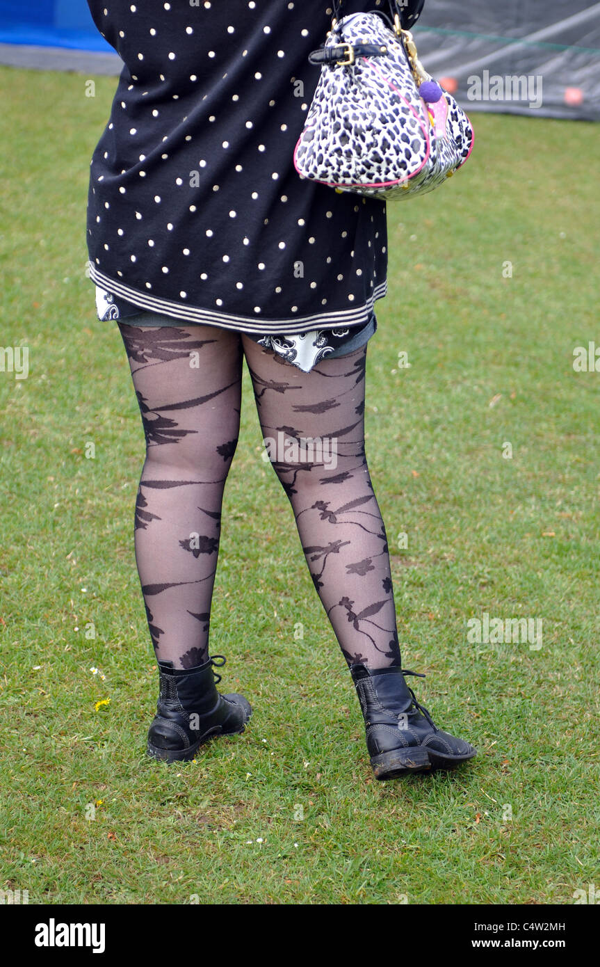 Young woman wearing boots and patterned lights Stock Photo