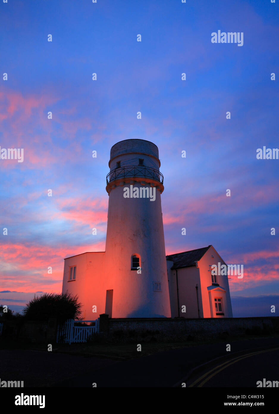 The lighthouse at Old Hunstanton against a colourful sunset. Stock Photo