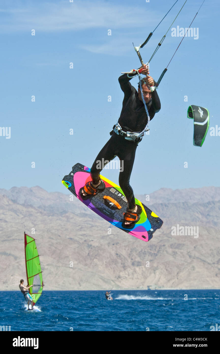 A close up view of a kite surfer in the middle of a jump at the resort of Eilat in Israel. Stock Photo