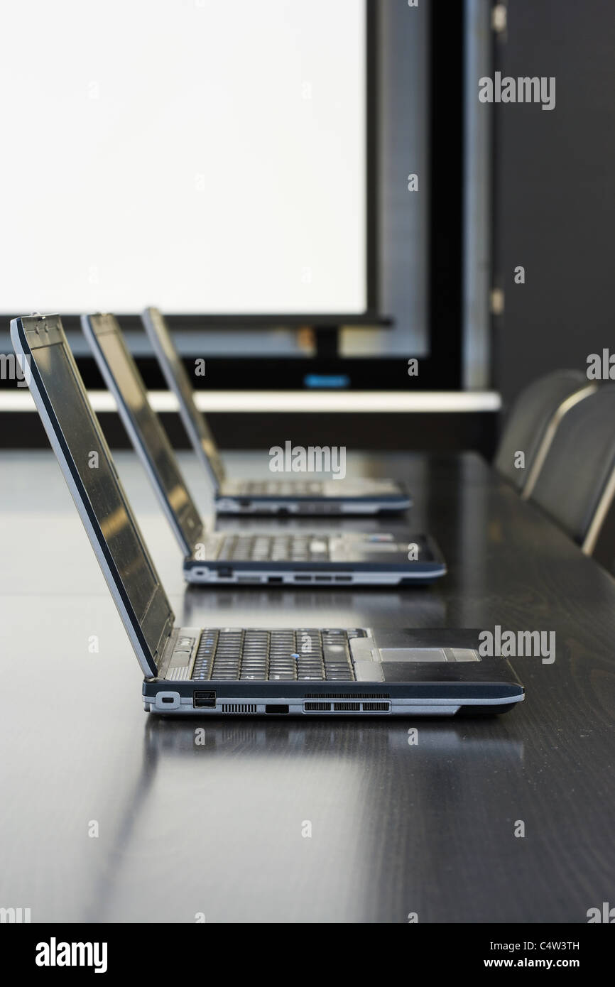 Laptops in conference room Stock Photo Alamy