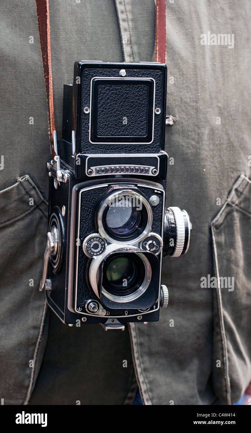 photographer with a vintage camera TLR Twin-Lens Rolleiflex Stock Photo