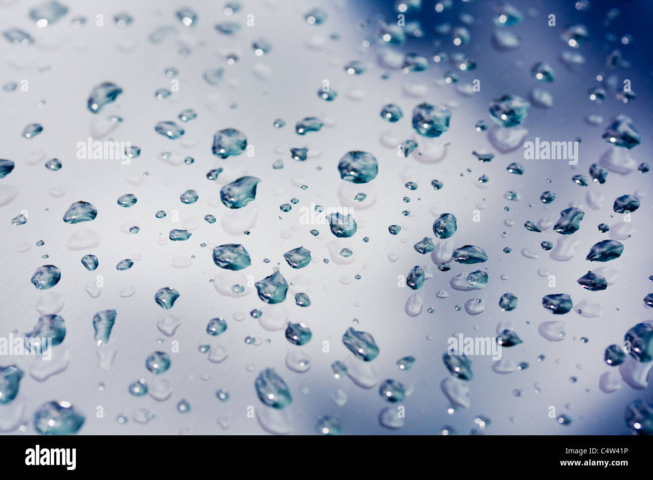 Blue abstract background of water droplets on glass Stock Photo - Alamy