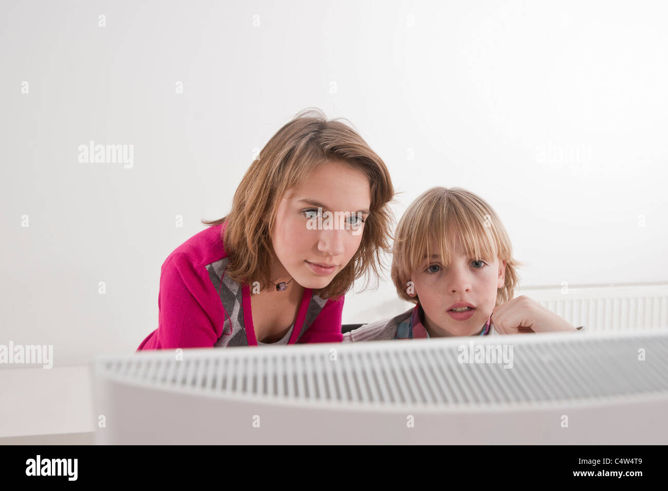 Teenagers using Computer Stock Photo - Alamy