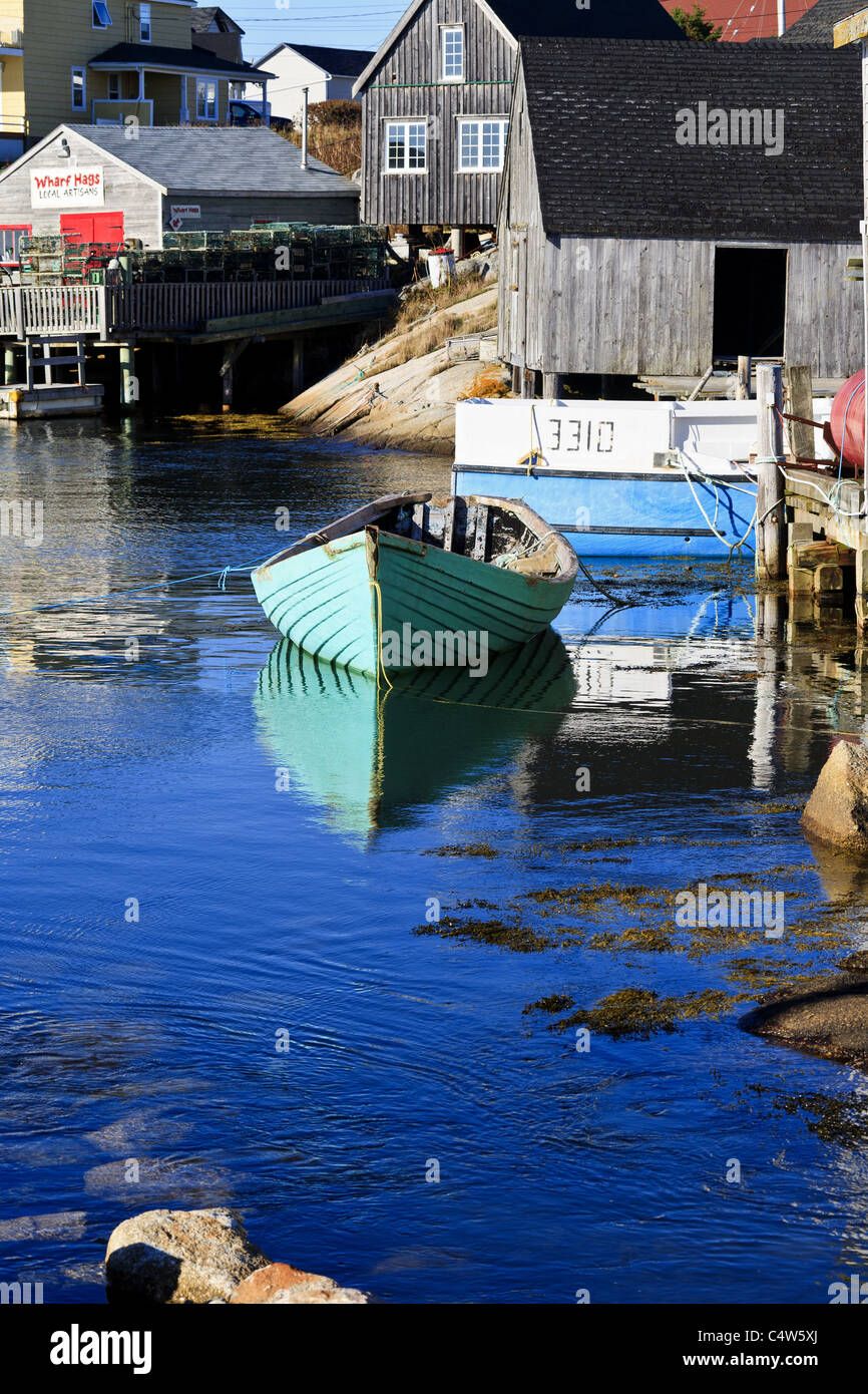 Fishing hut and boat at the idyllic fishing village of Peggys Cove on the eastern shore of St. Margarets Bay, Nova Scotia, Canada Stock Photo