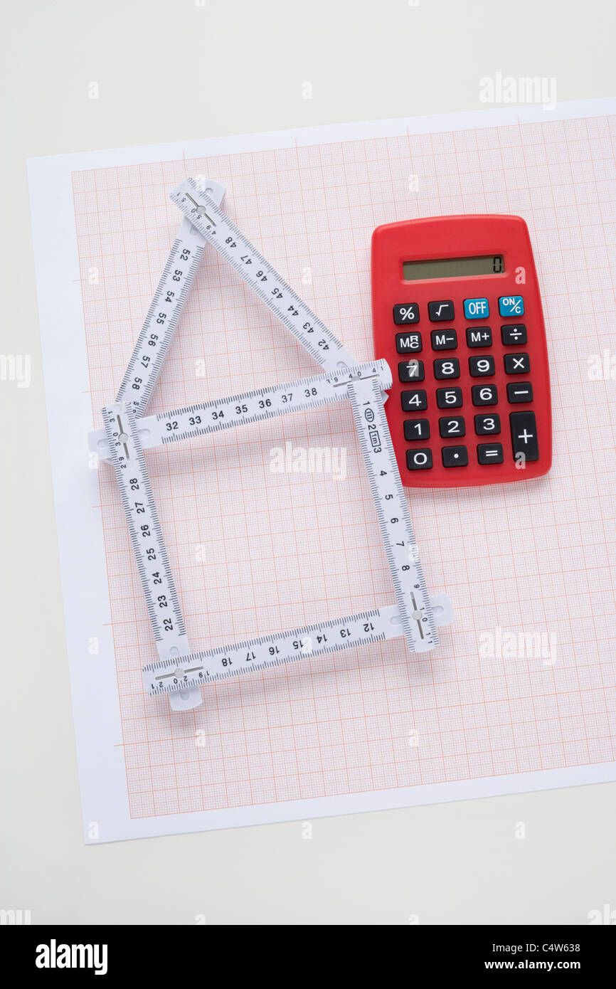 Folding Ruler in Shape of House with Calculator Stock Photo Alamy