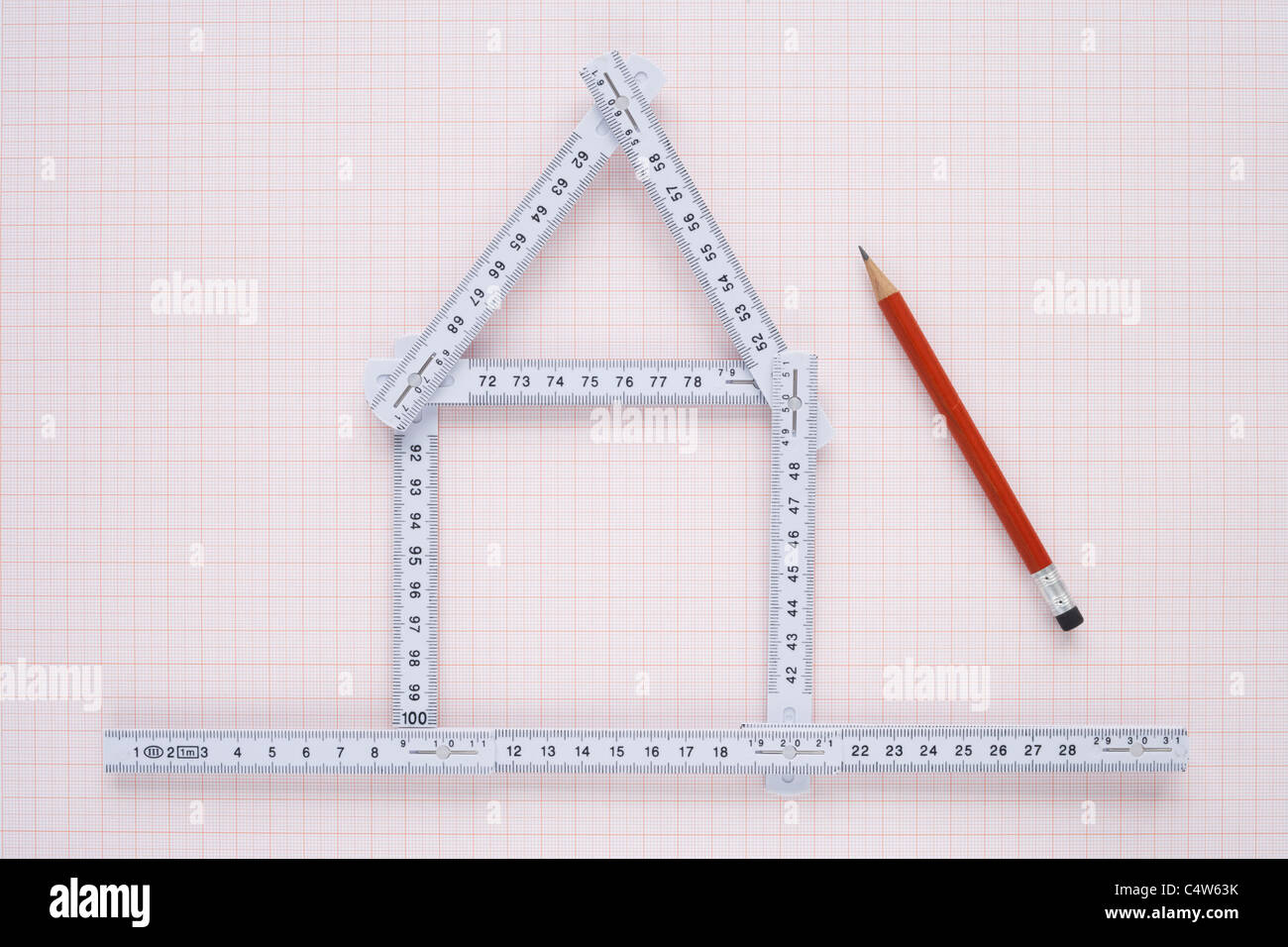 Folding Ruler in Shape of House and Pencil Stock Photo Alamy