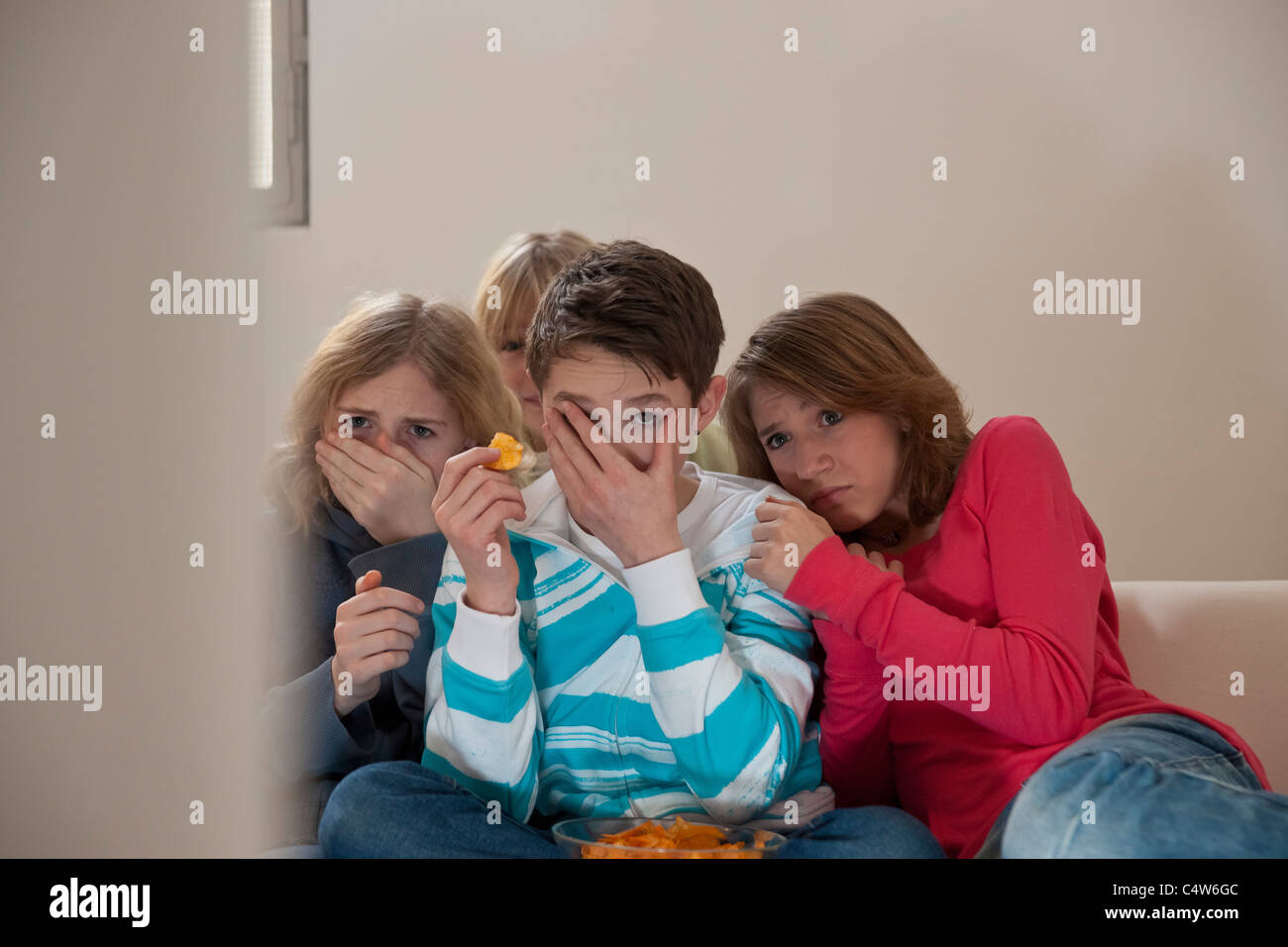 Teenagers Watching Television, Mannheim, Baden-Wurttemberg, Germany Stock Photo