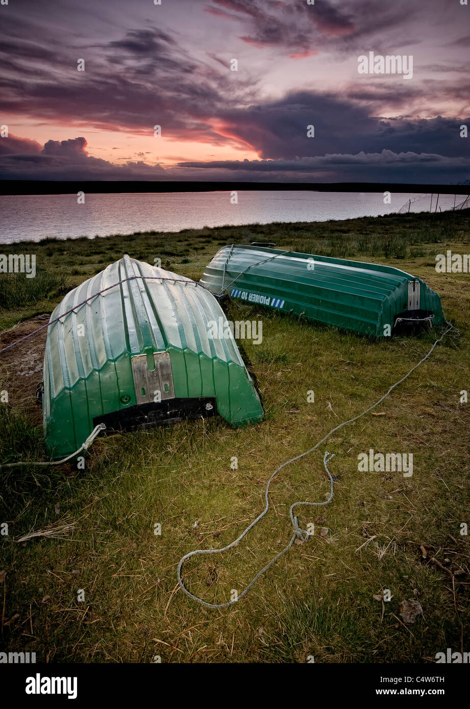 upturned rowing boats at a sailing club in the yorkshire pennines Stock Photo