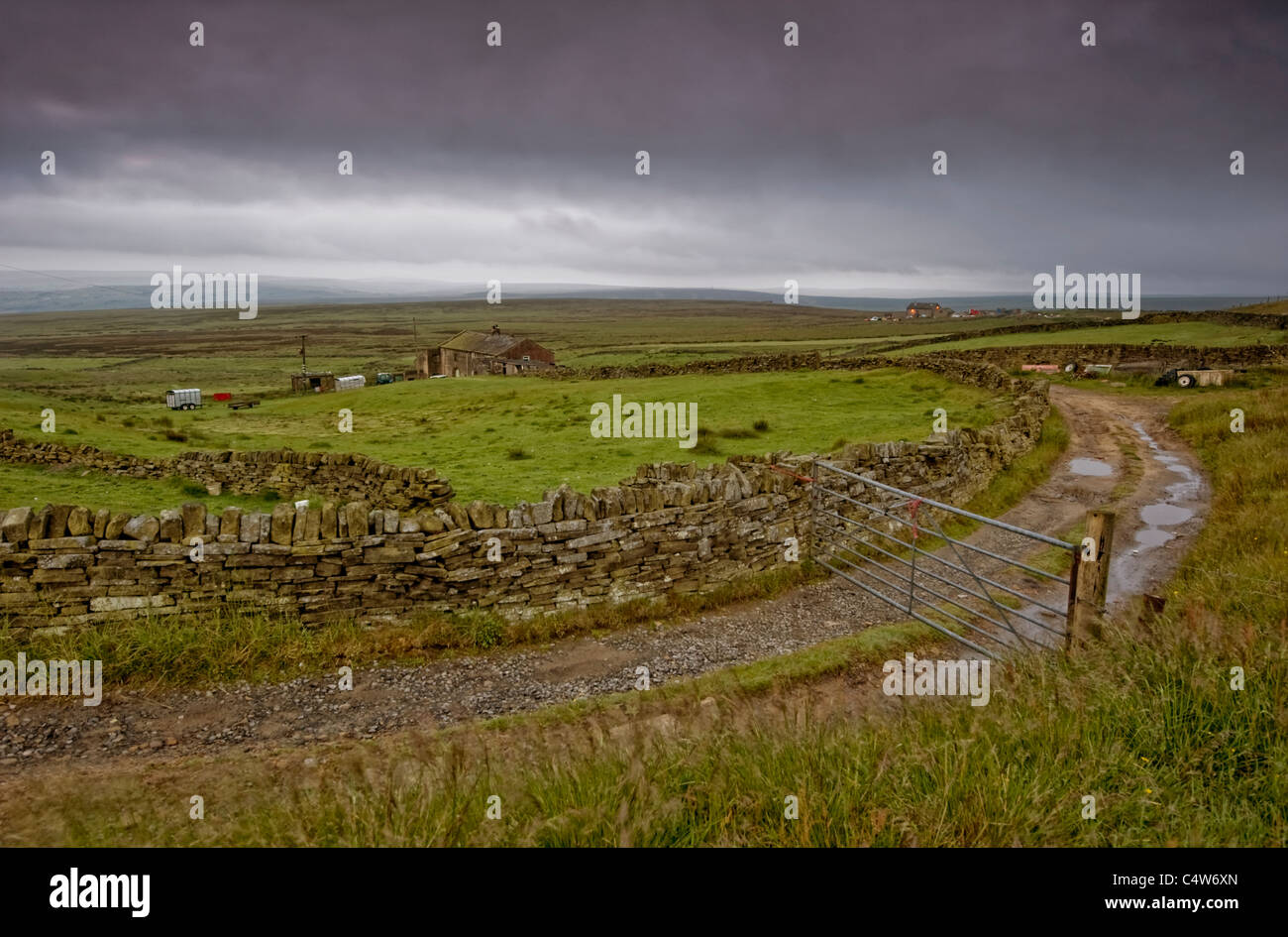 Moorland farmhouse in the Pennines on a bleak overcast day Stock Photo