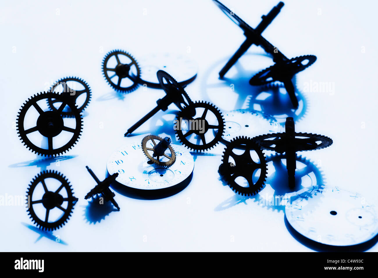Close up of gears and clock parts on white background Stock Photo Alamy