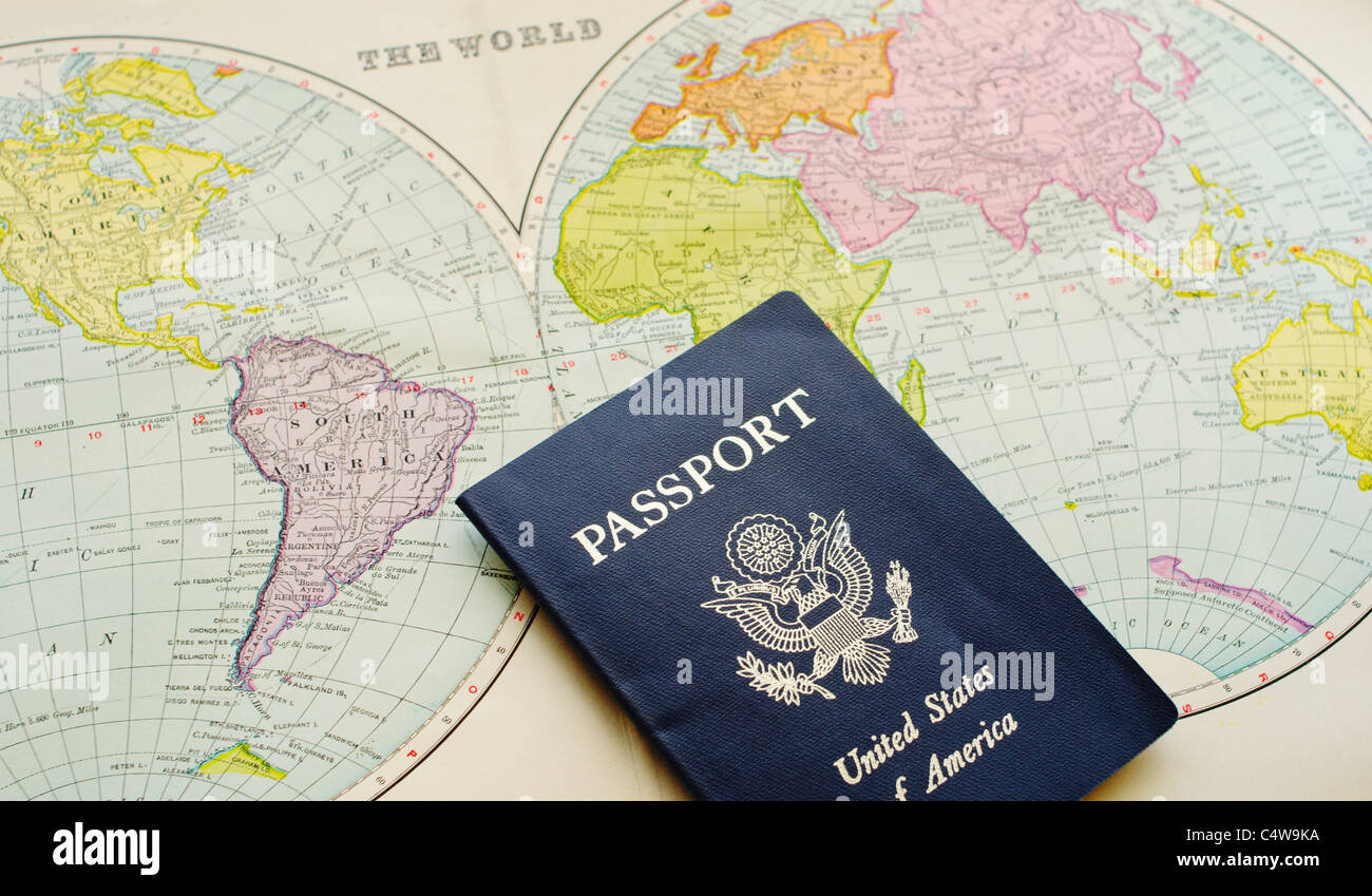 Close-up of passport lying on map Stock Photo