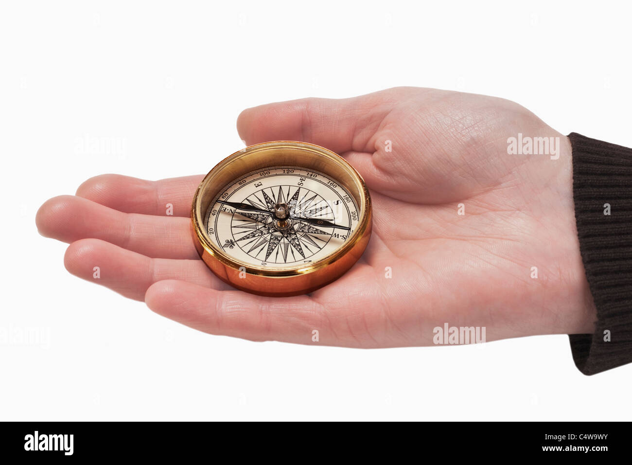 ein Kompass wird in der Hand gehalten | a compass is hand-held Stock Photo
