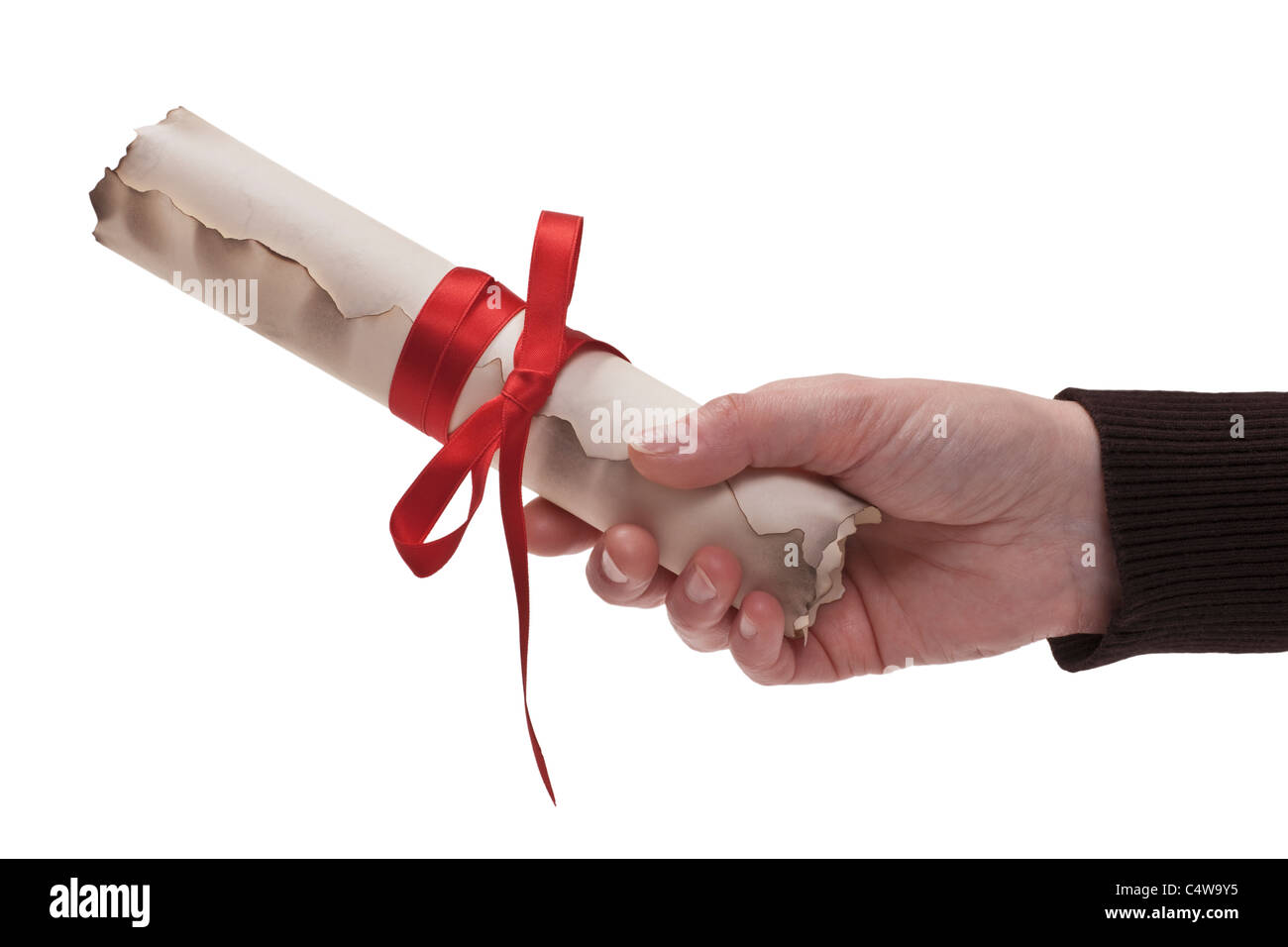 a old paper roll with a red lanyard is hand-held, background white Stock Photo