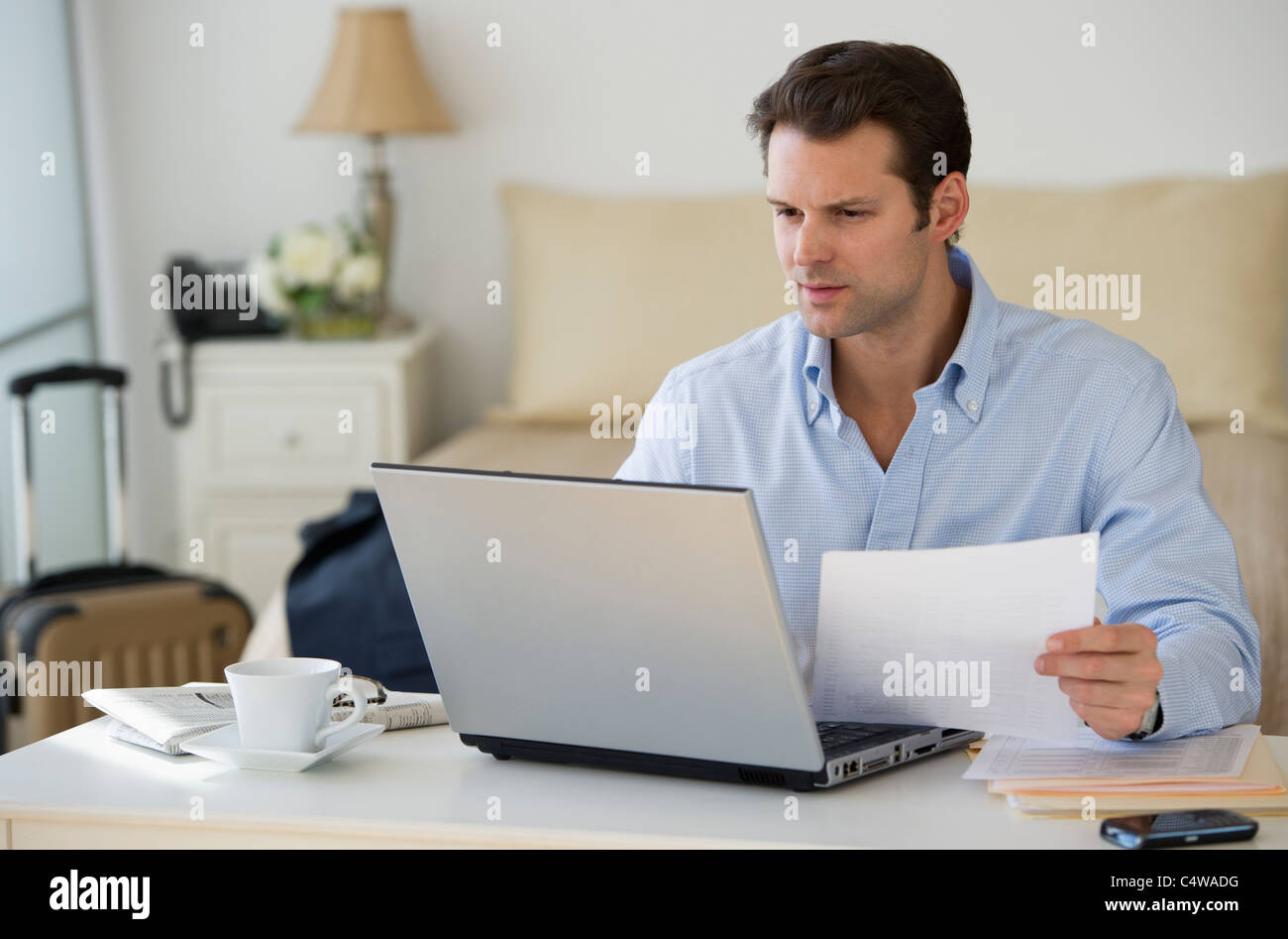 USA,New Jersey,Jersey City,man using laptop at home office Stock Photo