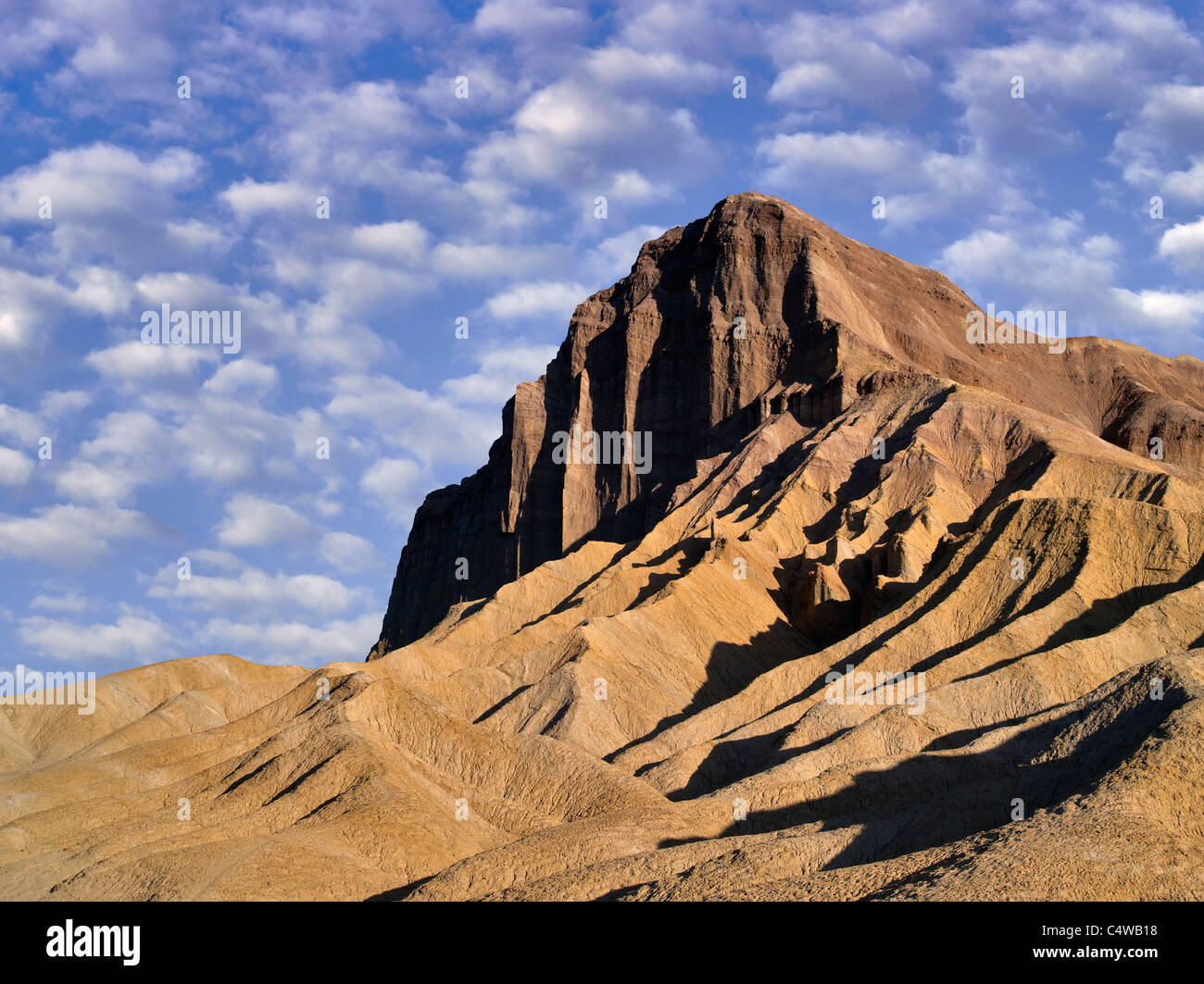 Manly peak as seen from Golden Canyon Trail. Death Valley National Park, California. Sky has been added. Stock Photo