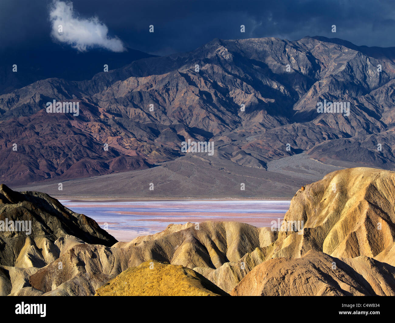 Colorful rock formations and storm as seen from Golden Canyon Trail. Death Valley National Park, California Stock Photo