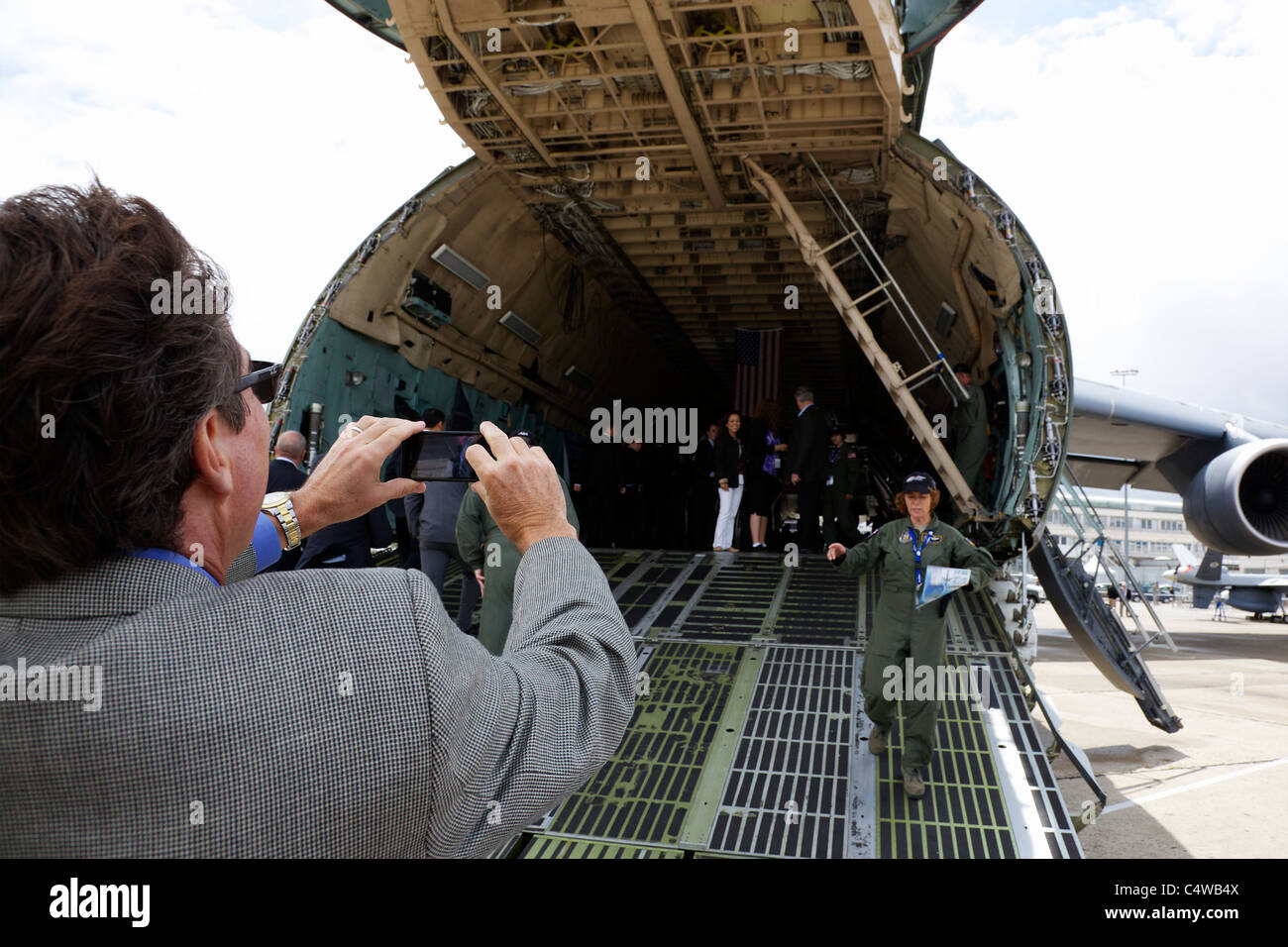 A man takes a photograph of the inside of a C-5M Super Galaxy at the Paris Air Show, June 2011 Stock Photo