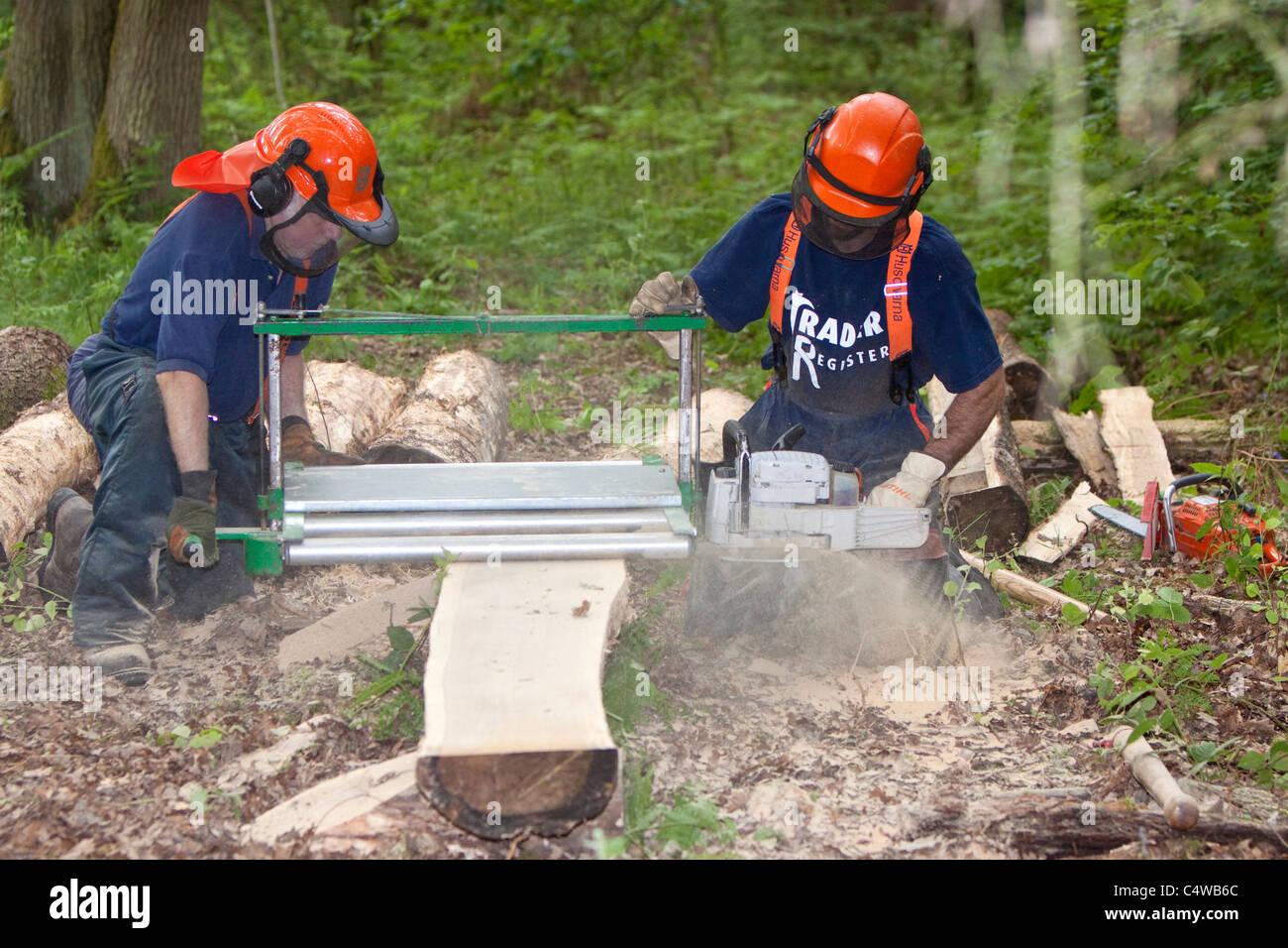 Making timber planks with a chainsaw, England, UK Stock Photo