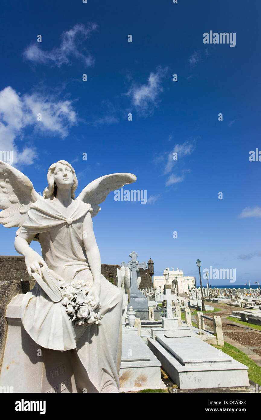 Puerto Rico, Old San Juan, Santa Maria Magdalena Cemetery with El Morro Fortress in background Stock Photo