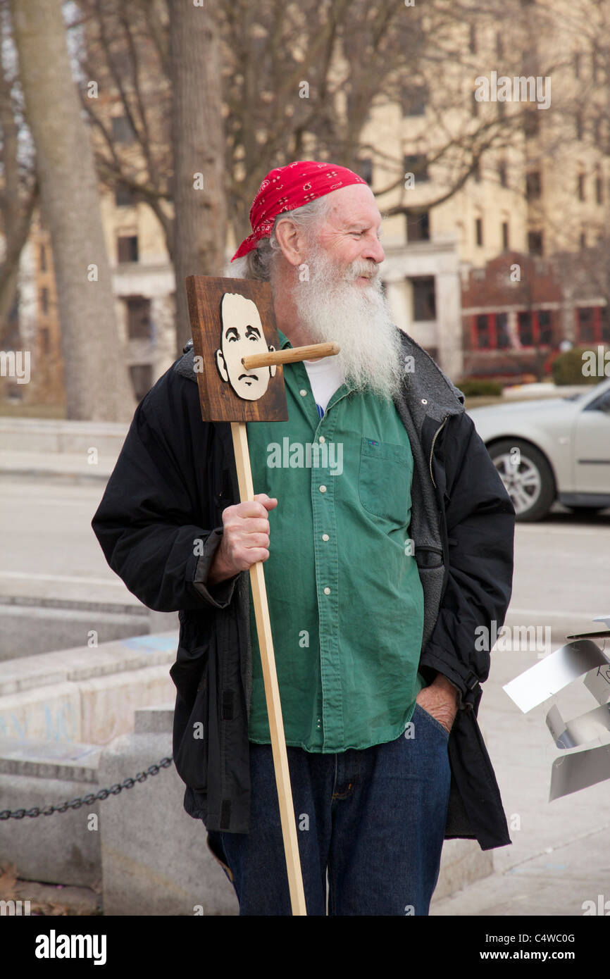 Protester holding caricature of Governor Scott Walker as Pinocchio. Stock Photo