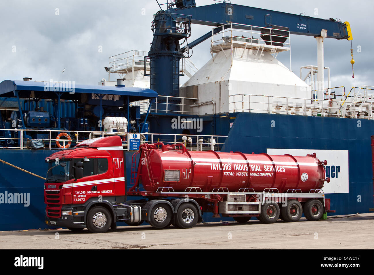 industrial service lorry alongside oil industry support vessel Waste