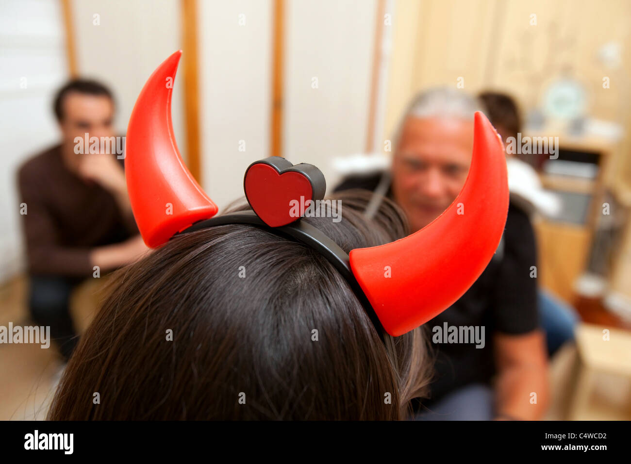 Psychodrama therapy session with man and woman playing the role of devil and angel. Stock Photo