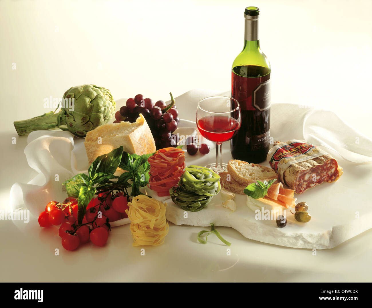 Still Italien food Artichokes, parmesan, tomatoes, basil, pasta