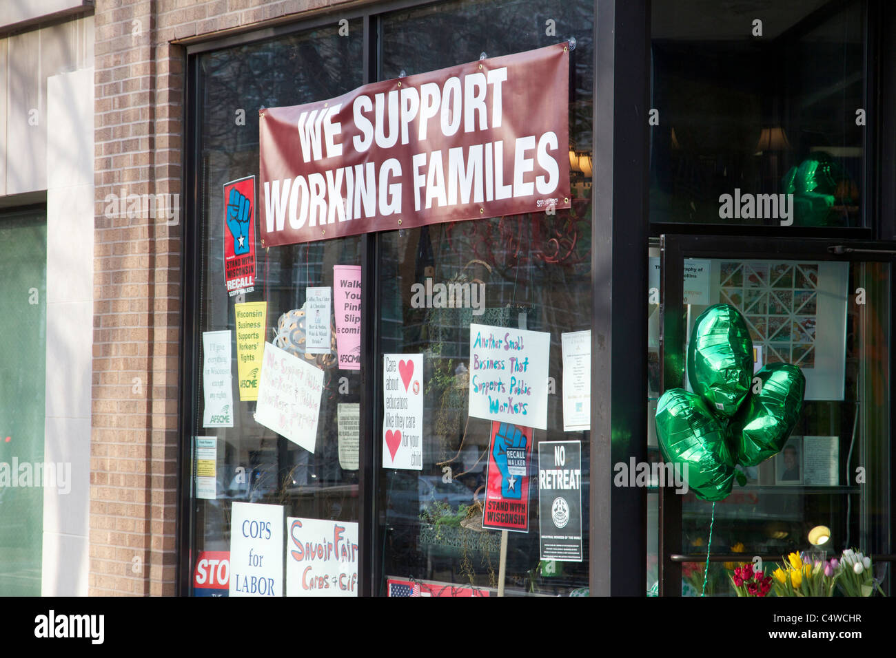 Business storefront with sign supporting unions Stock Photo - Alamy